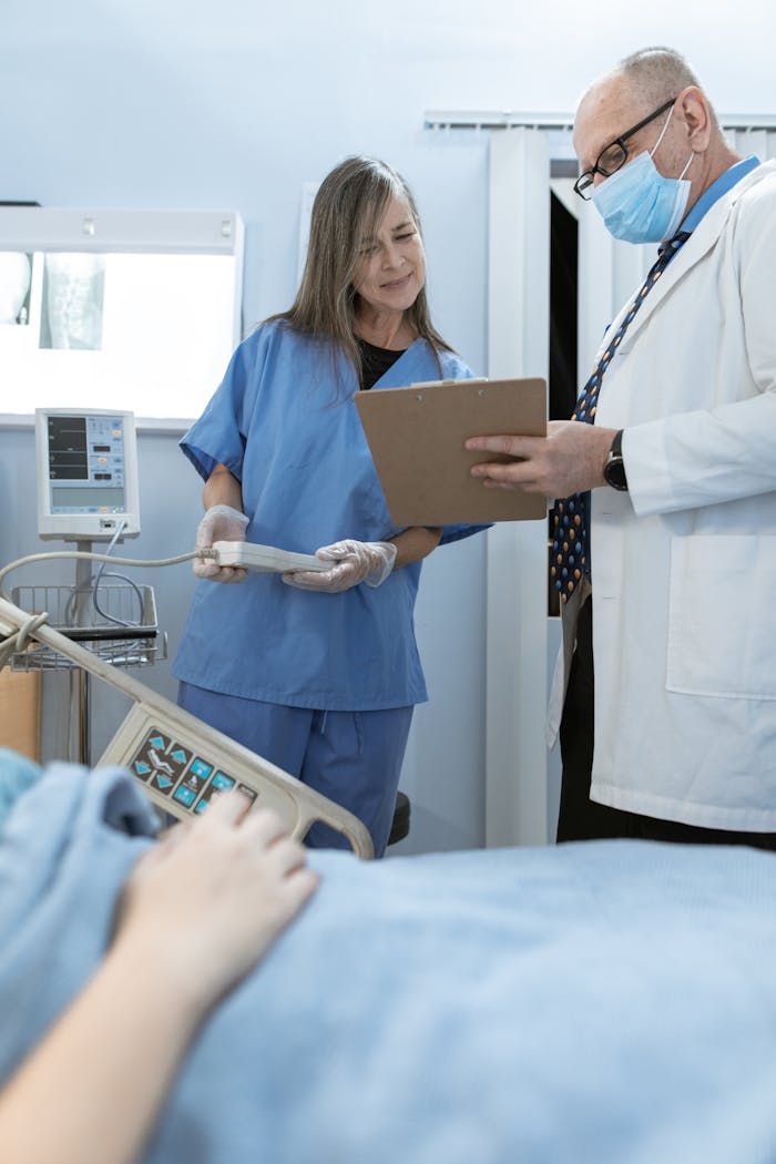 Doctor and nurse discussing patient care in a hospital setting